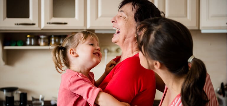 Happy grandmother and grandchild in the kitchen