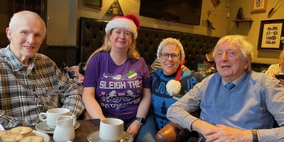 two LV employees and two older gentleman at a Christmas lunch