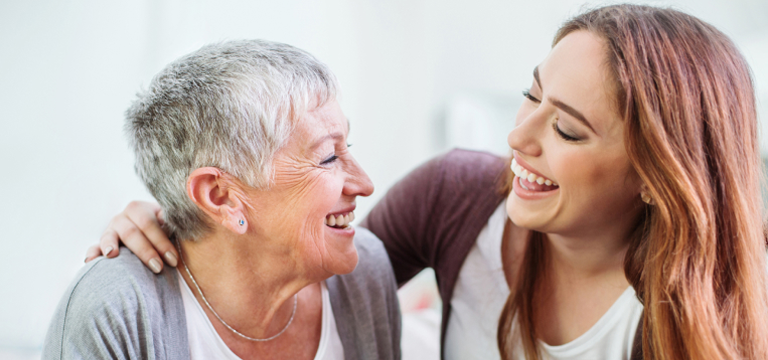mother and daughter smiling