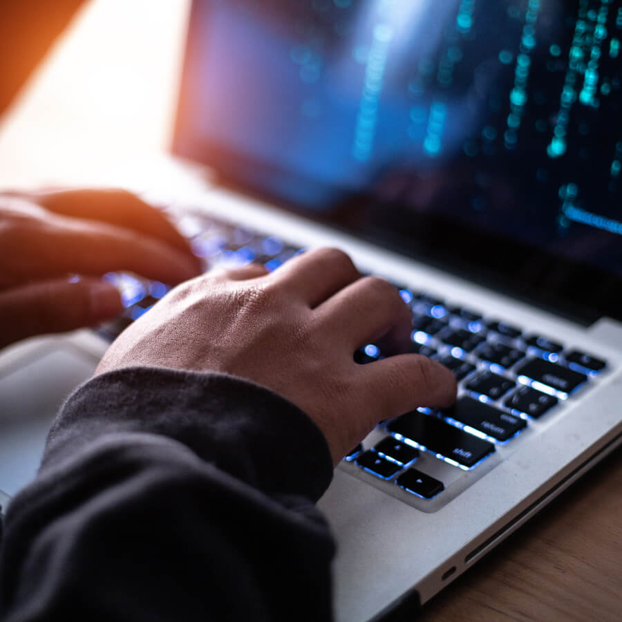 Person typing on a laptop