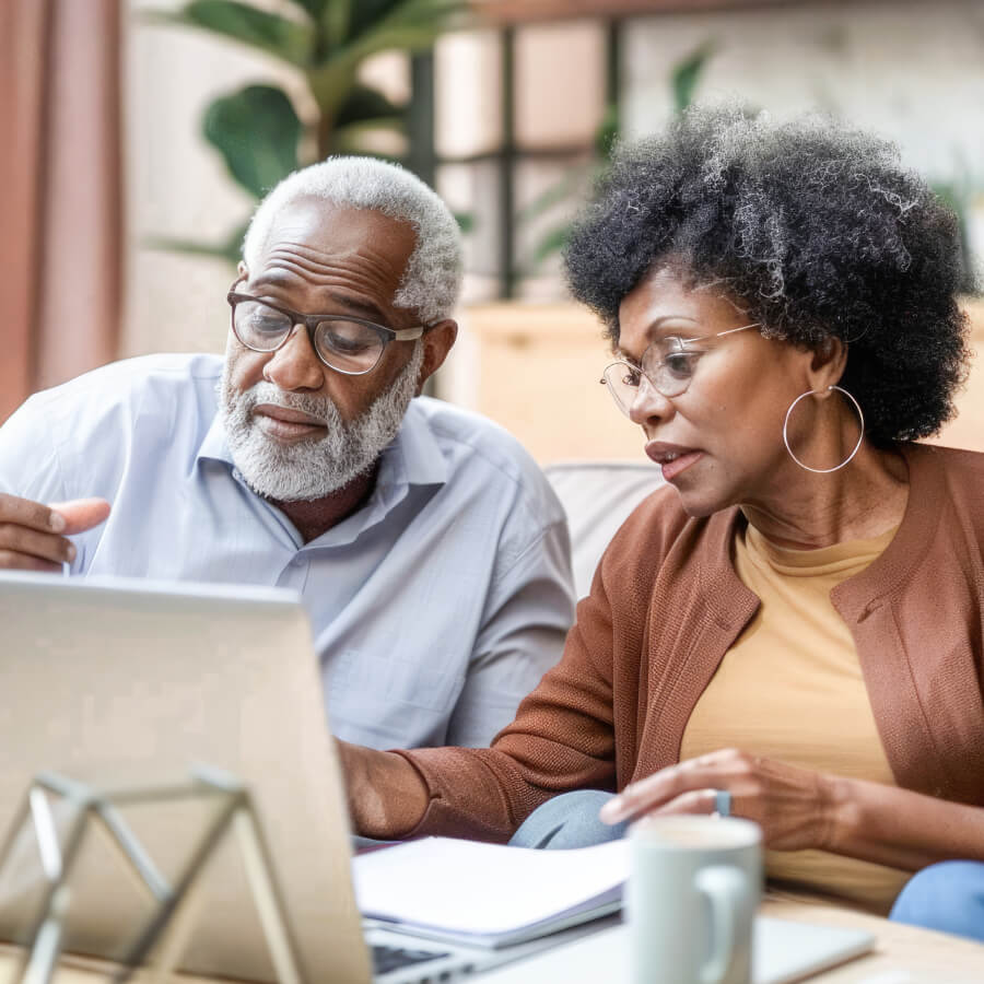 Older couple looking at a laptop