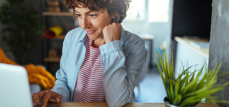young-lady-looking-at-laptop-768X360