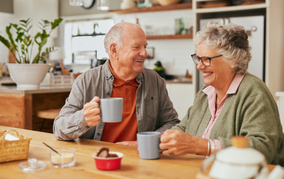 Elderly couple having a cup of tea together