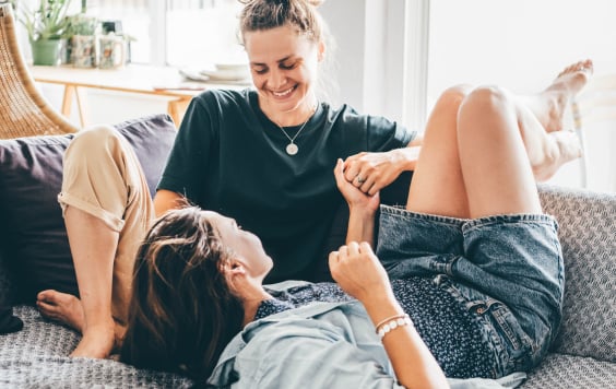 Female couple on a sofa