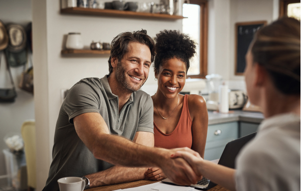 couple smiling on sofa