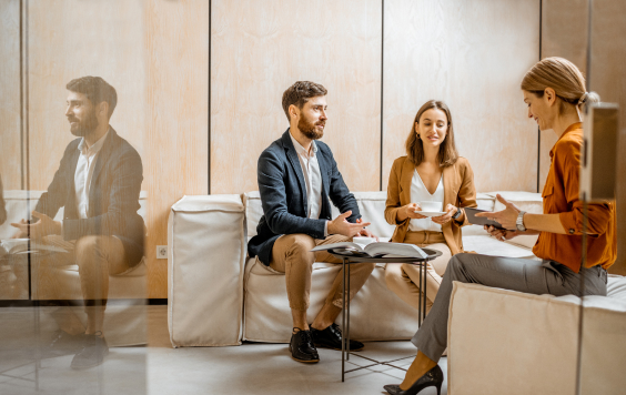 young couple talking to financial adviser