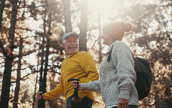Man and woman walking in forest