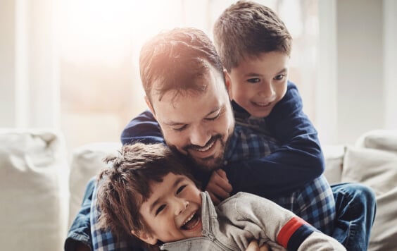 Dad laughing with his kids