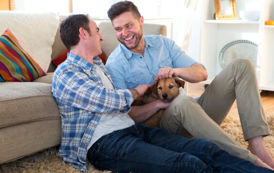 same sex male couple sitting on floor