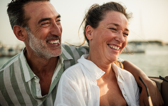 Couple smiling looking out into the distance