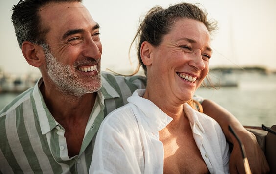 Couple smiling looking out into the distance