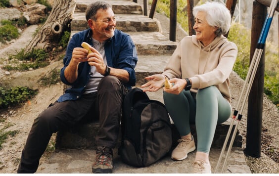 Older couple sitting on some steps outside