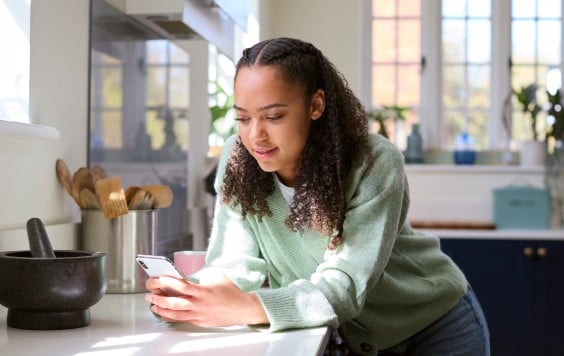 Woman smiling on her phone