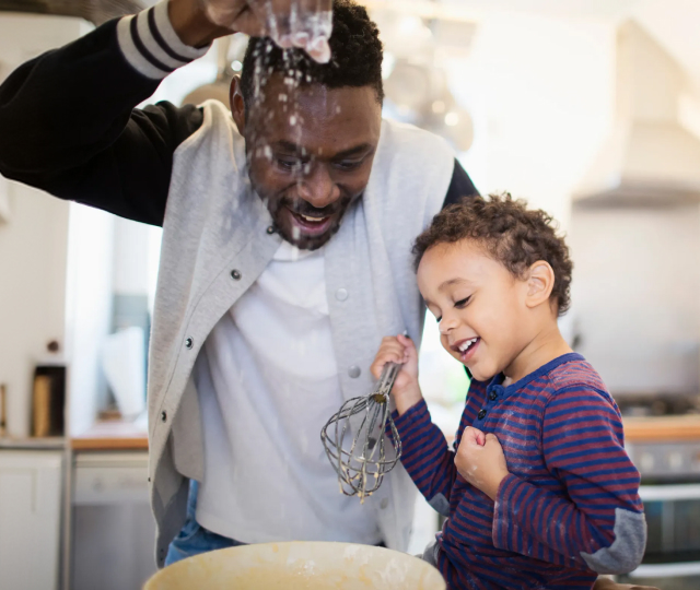 Father and son baking together