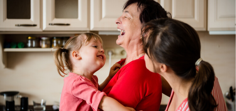 Happy grandmother and grandchild in the kitchen