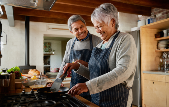 Elder couple cooking