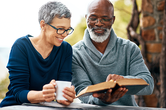 couple enjoying coffee and a book