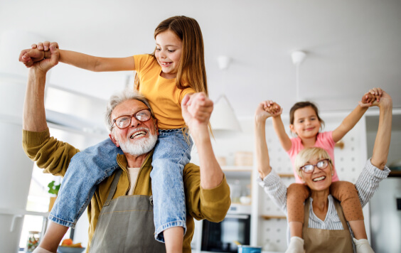 Grandparents playing with grandchildren