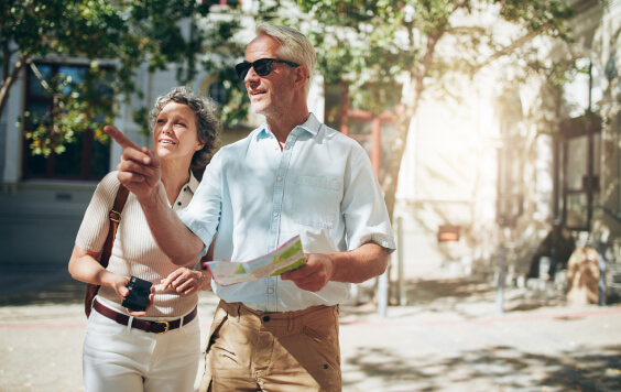 Elderly married couple exploring new city