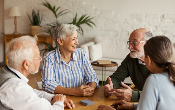 Older people sat around a table