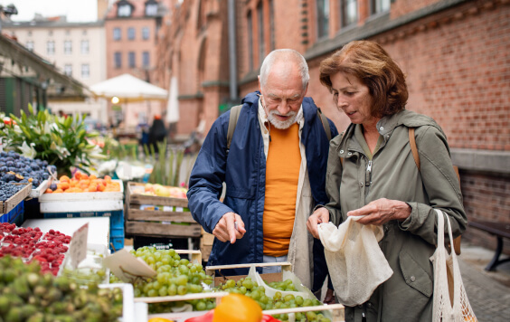 Older couple shopping at a food market