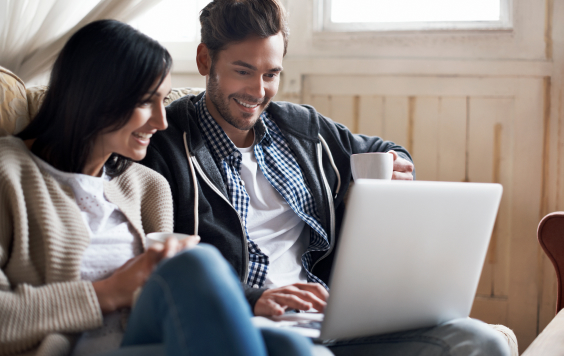 Couple looking at laptop screen