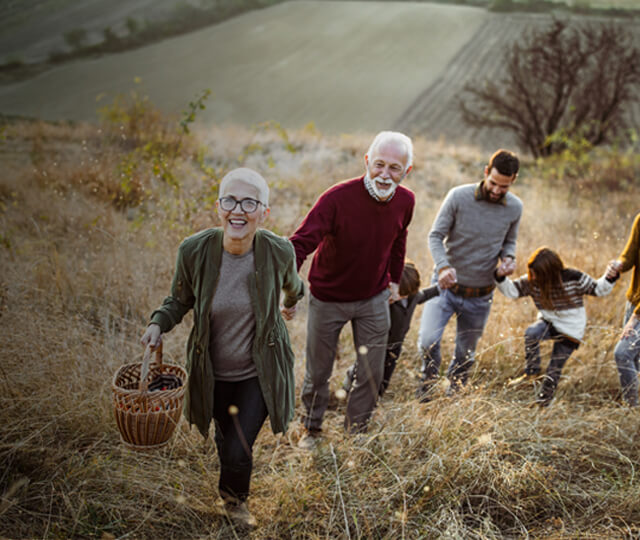 Family walking through a corn field