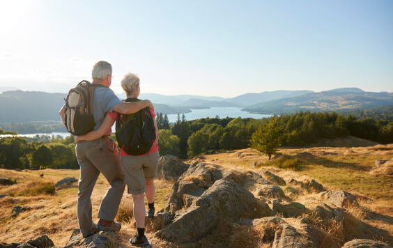 Couple looking out at the view on a cliff top