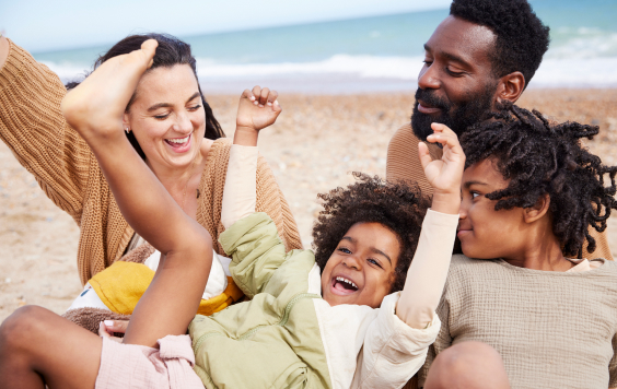 Family of four on the beach