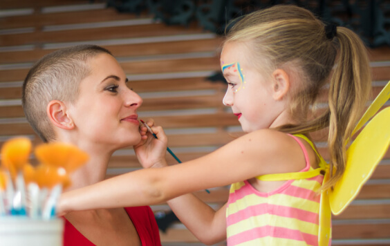 Mother and daughter playing with makeup