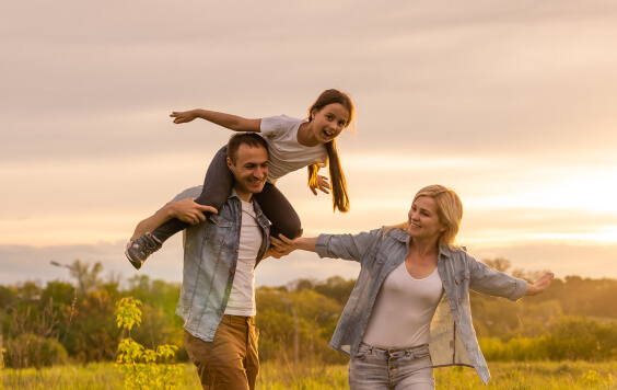 Family walk in a field