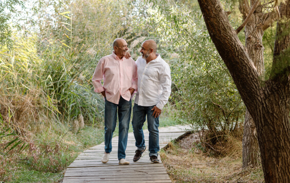 Two older males walking outside