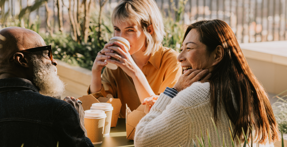 Friends sat drinking coffee