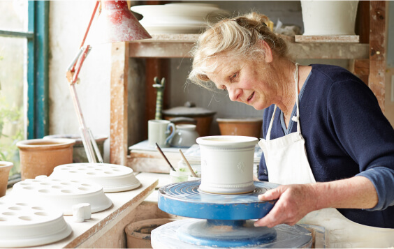 Older woman doing pottery