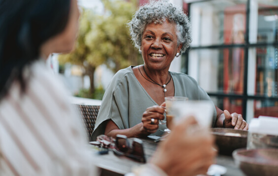 Older lady drinking outside
