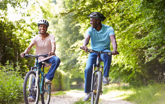 Mature African American Couple On Cycle Ride In Countryside