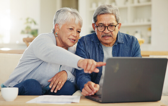 Couple looking at a laptop