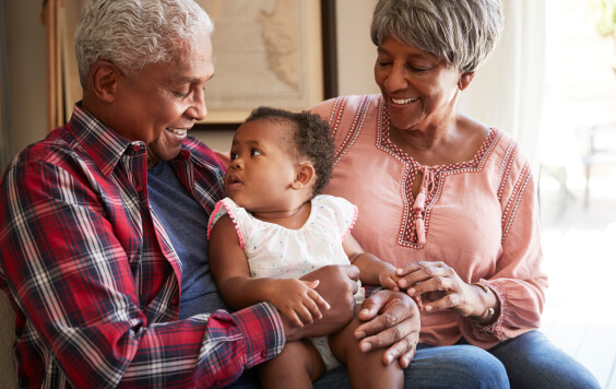Grandparents sat with their grandchild