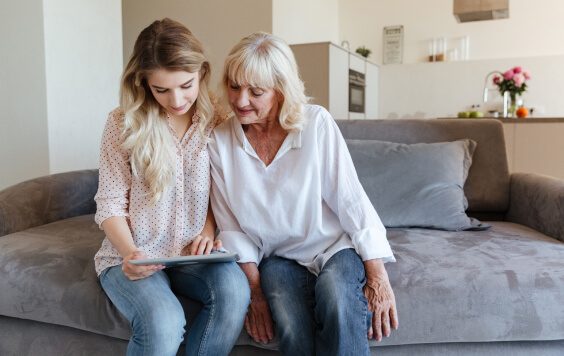 Mum and daughter looking at iPad