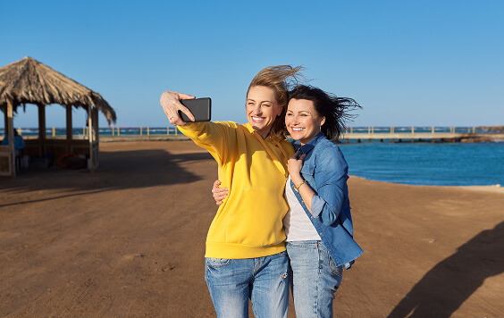 Two women taking a selfie on the beach