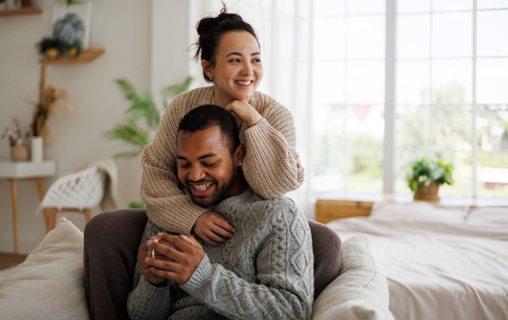 Couple hugging and laughing