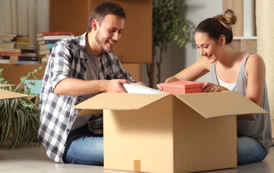 Couple unboxing a package