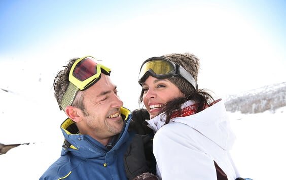 Couple having fun skiing