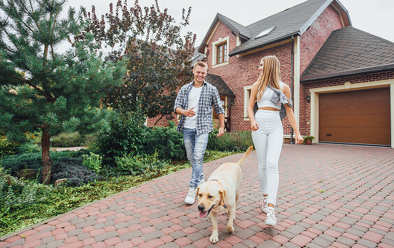 Couple walking their dog