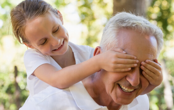 Young girl playing with Grandad