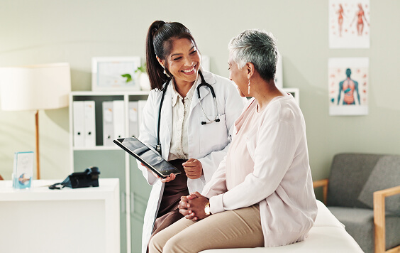 Doctor sitting and talking with patient