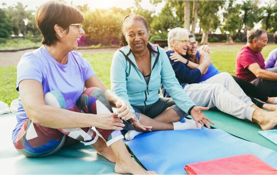 Women doing yoga in a field