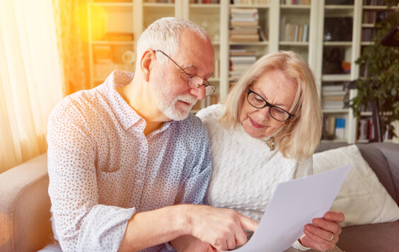 Older couple looking through some documents
