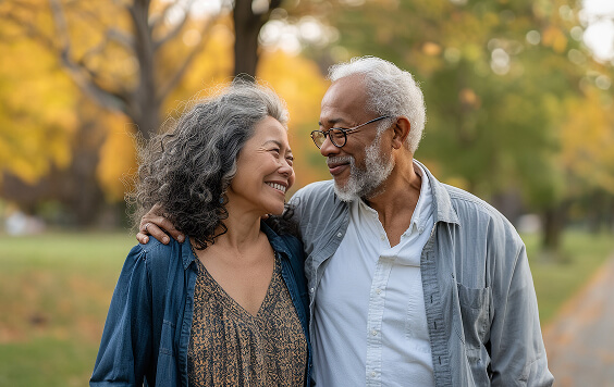 Older couple walking outside in a forest