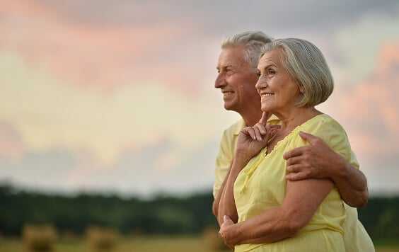 Older couple at a viewpoint outside
